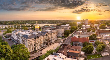 Aerial panorama of Trenton New Jersey skyline amd state capitol at sunset. Trenton is the capital city of the U.S. state of New Jersey and the county seat of Mercer County. - obrazy, fototapety, plakaty
