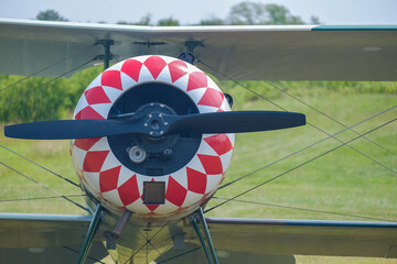 Red and white painted cowling on an old and restored antique WWI airplane