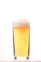 glass of fresh beer on white background