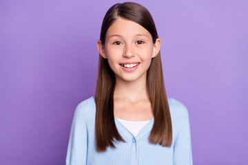 Photo of cute brunette little girl wear blue shirt isolated on violet color background