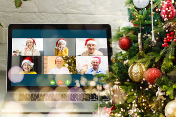 Virtual Christmas meeting team teleworking. Family video call remote conference Computer webcam screen view. Diverse portrait headshots meet working from their home offices. Happy hour party online.