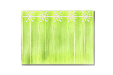 Winter wooden green grass herbal yellow nature background with snowflakes top. Texture of painted wood vertical boards on a white background. Christmas, New Year card with copy space.