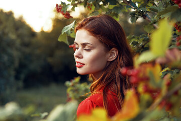 woman in red dress green leaves nature freedom summer