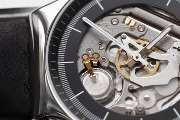 Swiss made quartz skeleton wrist watch, black deal and hands