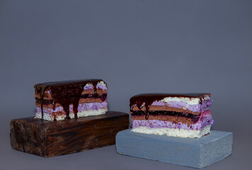 Blackberry cake. Flat design. Sweet dessert. premium recipes and offers. the cake is served on a wooden tray. a combination of the texture of a delicate cream cake and rough wood. copy space