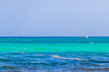 Obraz premium Boats yachts between Cozumel island and Playa del Carmen Mexico.