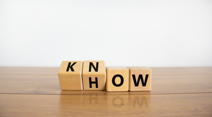 Know how symbol. Turned wooden cubes and changed the word 'how' to 'know'. Beautiful wooden table, white background. Copy space. Business and know how concept. - obrazy, fototapety, plakaty
