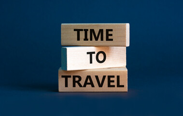 Time to travel symbol. Wooden blocks with concept words 'Time to travel' on beautiful grey background. Business and time to travel concept. Copy space.