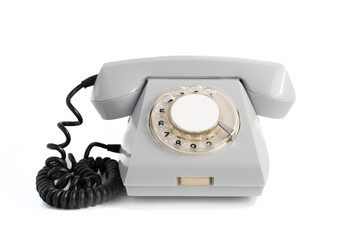 Old disused landline gray colored telephone close-up isolated on white background with shadow - obrazy, fototapety, plakaty