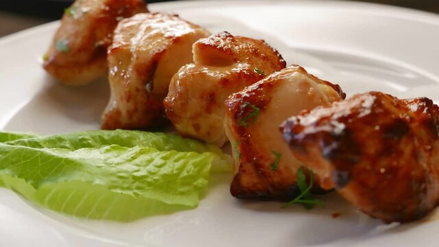 Chicken barbecue shish kebab for dinner. Nice grilled meat food rotating