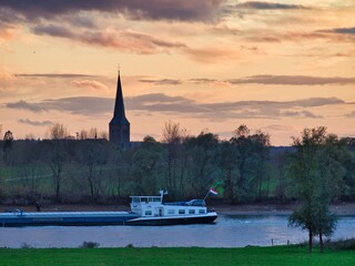 Fototapeta na wymiar ship on river with church