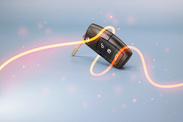 Car key on blue background with light trails, particles, symbol image for: i give you a car for birthday christmas or passed car test, high resolution 8k photo