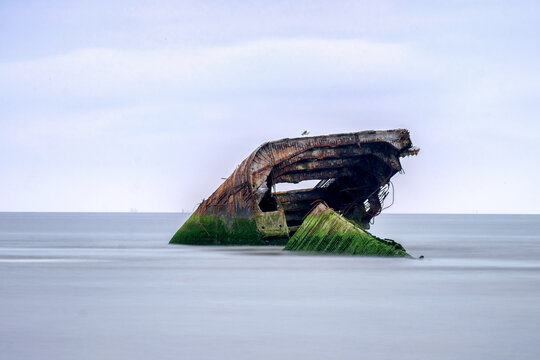 What Remains Of A Sunken Concrete Ship On The Shore Of Cape May Beach