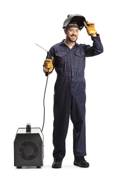 Full length portrait of a man in a uniform holding a welding generator