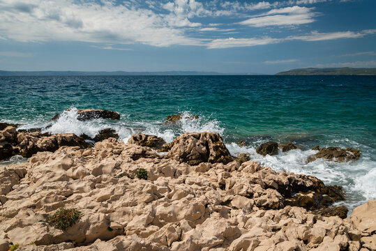 Big waves on beach with stones in Makarska. Makarska is the center of the Makarska Riviera, a popular tourist destination in Central Dalmatia in Croatia