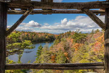 Lake Minnewaska framed in rustic wood at Minnewaska State Park on a brilliant fall day