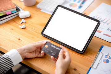 young woman holding credit card and using a laptop computer business woman working from home, online shopping, ecommerce, internet banking, spending money, finance, work from home concept..