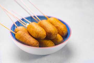 Corn dogs cooked with sausage and dough, side view - obrazy, fototapety, plakaty
