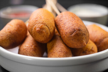 Corn dogs cooked with sausage and batter - obrazy, fototapety, plakaty
