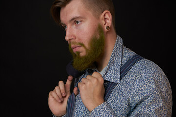 bearded man elegant style shirt dark background