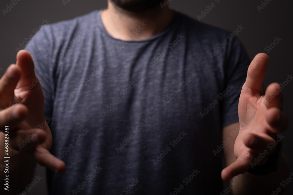 Poster man showing his empty hand.