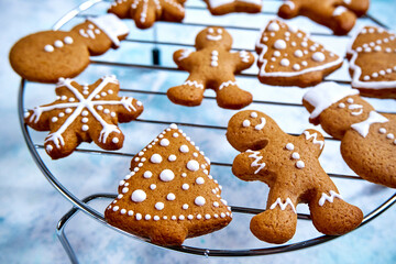 Christmas homemade gingerbread cookies on blue background