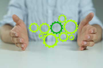 Mechanism green gears and cogs at work on black background. Industrial machinery. 3D illustration....