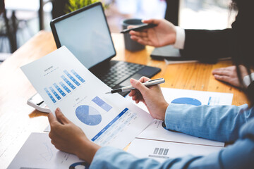 Team work with business analytic price chart on the table at the conference room.
