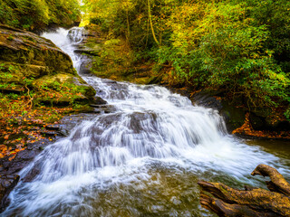 Fototapeta na wymiar Fall color around Mud Creek Falls in Sky Valley in Rabun County Georgia USA