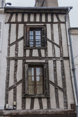 Fototapeta na wymiar Architecture of Half-timbered buildings in old quarters of Orleans. Orleans is a city in north-central France, about 111 kilometers southwest of Paris.