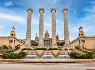 Fototapeta na wymiar Four stone columns in front of the National Palace in Barcelona. A symbol of Catalanism.
