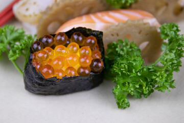 Traditional Japanese Food, Fresh Salmon's Eggs top on Rice,  
Ikura Nigiri Sushi , on Black Background