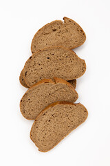 slices of rye bread on white background, top view