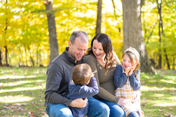 Fototapeta premium Happy young family having fun at the park