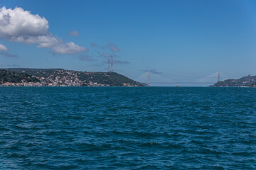 The third bridge view from a distance  over the blue Bosphorus Istanbul, under the beautiful sky with white clouds.