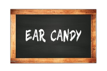 Obraz premium EAR CANDY text written on wooden frame school blackboard.
