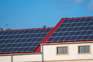 Fototapeta premium Solar panels on the roof of the building