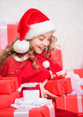 Explore christmas gifts. Unpacking christmas gift. New year holiday tradition. Kid excited about opening christmas present. Girl celebrate christmas. Santa bring her gift. Winter happiness concept