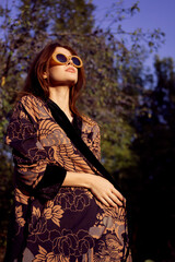 pretty woman wearing sunglasses outdoors fashion nature