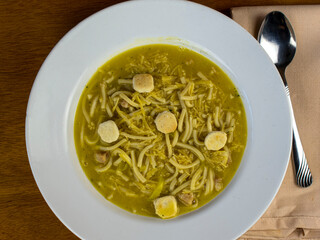 chicken noodle soup top with oyster crackers