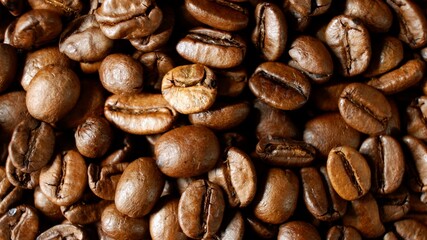 Close up of freshly roasted coffee beans as a texture