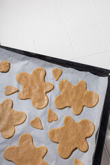 Ingredients for Christmas cookies with cinnamon on a baking sheet top view