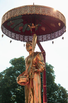 Closeup of the statue of the golden statue of Kruba Sri Wichai at the Wat Phra Singh temple grounds