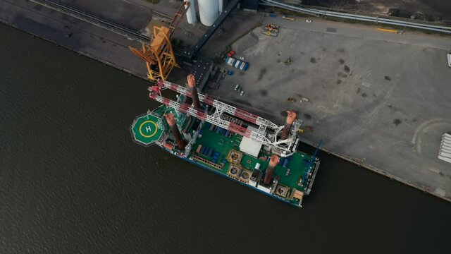 Aerial view of Liebherr Seafox 5 offshore crane moored in front of Esbjerg's Power Station in Denmark. With a maximum lifting capacity of 1,200t is the biggest crane of the board offshore crane series
