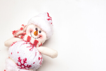 snowman with Christmas hat and scarf, located on the left with white background and top view
