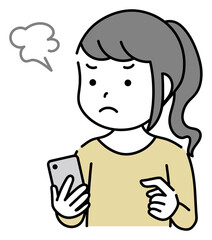 スマホを操作するイライラしている子供　女の子