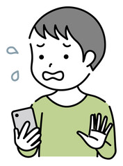 スマホを操作する焦っている子供　男の子