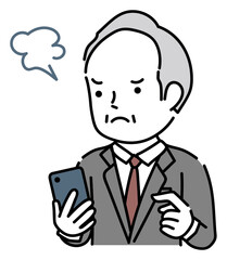 スマホを操作するイライラしているシニア男性ビジネスパーソン