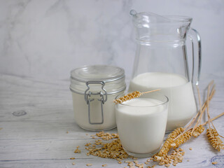  oat milk in a glass on a wooden background