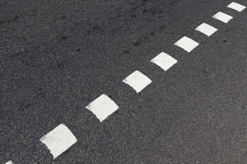 paved road, a close-up of a part of the carriageway of an asphalt road - obrazy, fototapety, plakaty